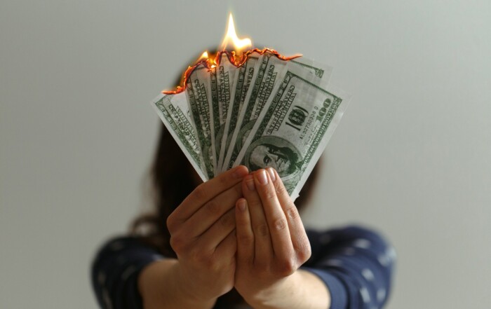a fan of fake American dollars on fire